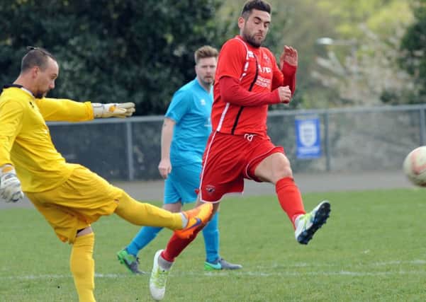 AFC Mansfield scorer Phil Buxton puts pressure on Clipstone's keeper. PHOTO: Anne Shelley