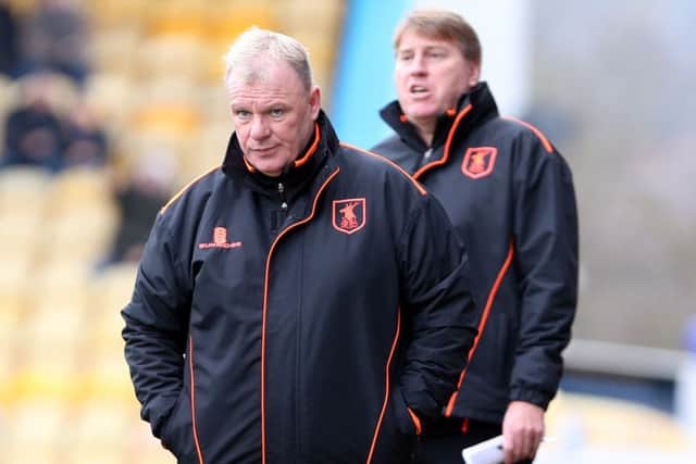 Mansfield Town Manager Steve Evans with assistant Paul Raynor behind.
Picture by Dan Westwell.