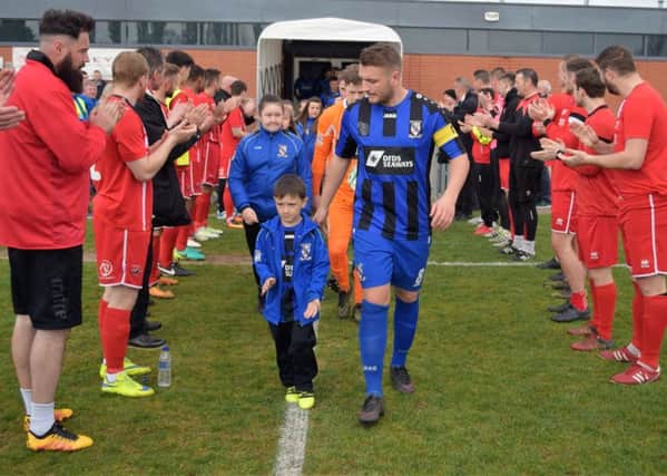 AFC Mansfield players line up in a guard-of-honour tribute to champions Cleethorpes Town.