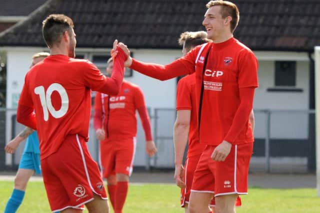 Action from Saturday's game against AFC Mansfield and Clipstone.Mansfield's first goal scorer, Phil Buxton, (10) congratulates their second, Ollie Fearon.