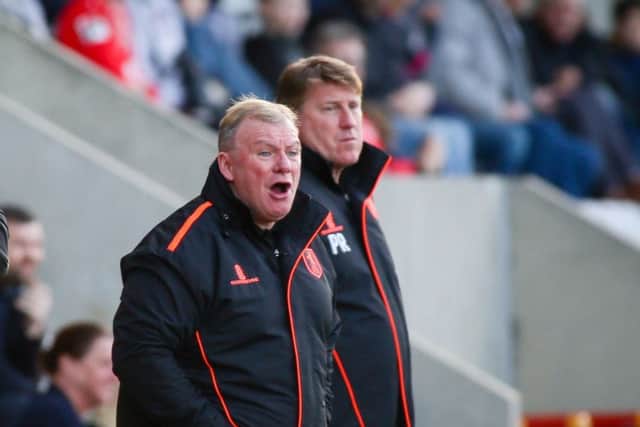 Mansfield Town's Manager Steve Evans and his assistant Paul Raynor - Photo by Chris Holloway