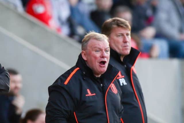 Mansfield Town's Manager Steve Evans and his assistant Paul Raynor - Photo by Chris Holloway