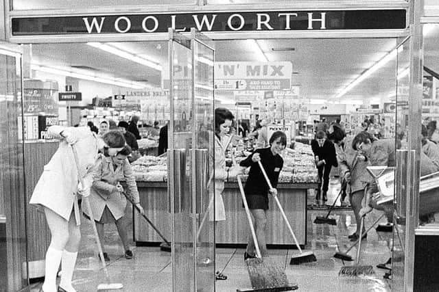 Staff mop out the Mansfield Woolworth store after it flooded in 1971