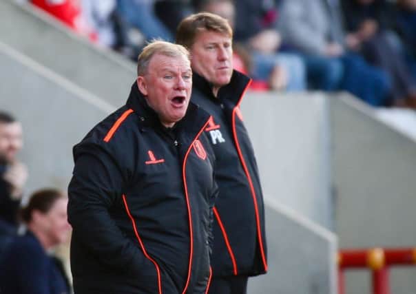 Mansfield Town's Manager Steve Evans and his assistant Paul Raynor - Photo by Chris Holloway