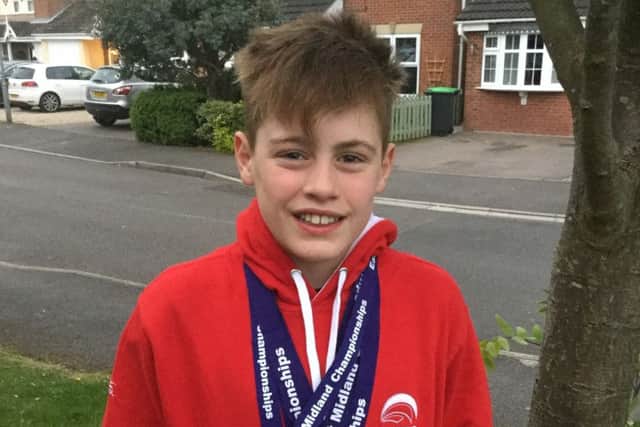 Matthew Woodhall with his collection of medals.