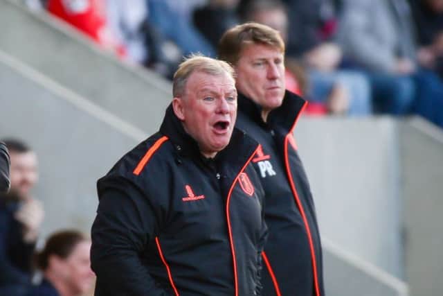 Mansfield Town's Manager Steve Evans and his assistant Paul Raynor - Photo by Chris Holloway