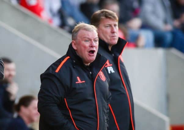 Mansfield Town's Manager Steve Evans and his assistant Paul Raynor - Photo by Chris Holloway