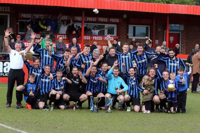 Selston players and officials celebrate the win.