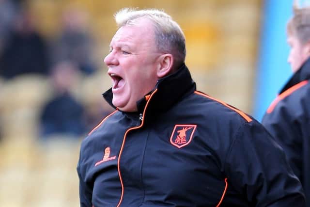 Mansfield Town Manager Steve Evans with assistant Paul Raynor behindPicture by Dan Westwell