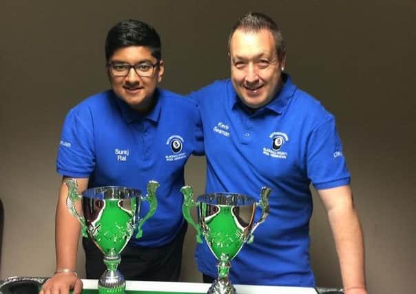 Newly-crowned European pool champions Suraj Rai and Kev Seaman with their trophies.