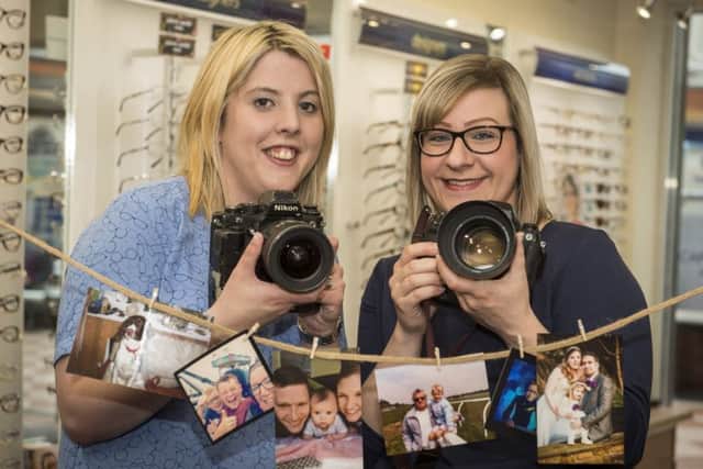 Branch manager Sarah Smith and her assistant Emma Whetton with their cameras at the ready