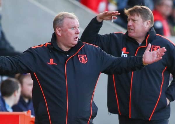 Mansfield Town's Manager Steve Evans with his assistant Paul Raynor - Photo by Chris Holloway