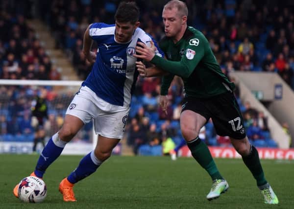 Chesterfield's Ched Evans battles with Scunthorpe's Neal Bishop