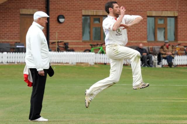 Tom Lungley, who took three wickets, in bowling action for Welbeck against Attenborough.