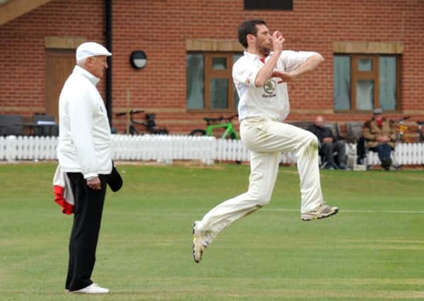 Tom Lungley, who took three wickets, in bowling action for Welbeck against Attenborough.