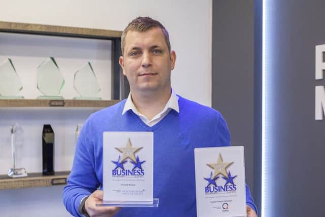 Matt Wheatcroft with his awards at Purpose Medias head office.