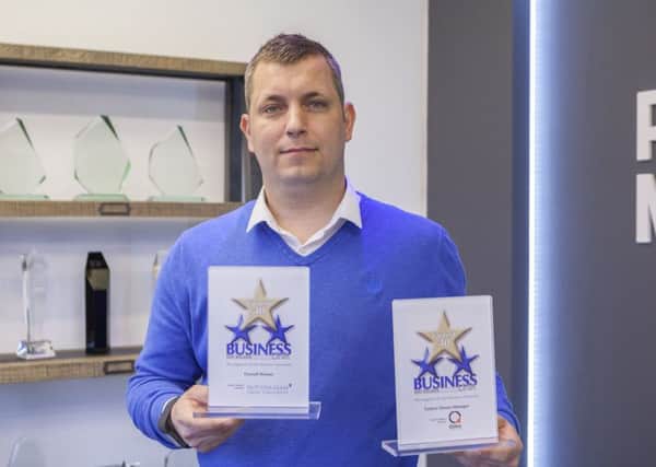 Matt Wheatcroft with his awards at Purpose Medias head office.