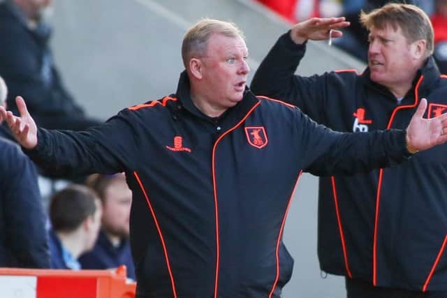 Mansfield Town's Manager Steve Evans with his assistant Paul Raynor - Photo by Chris Holloway