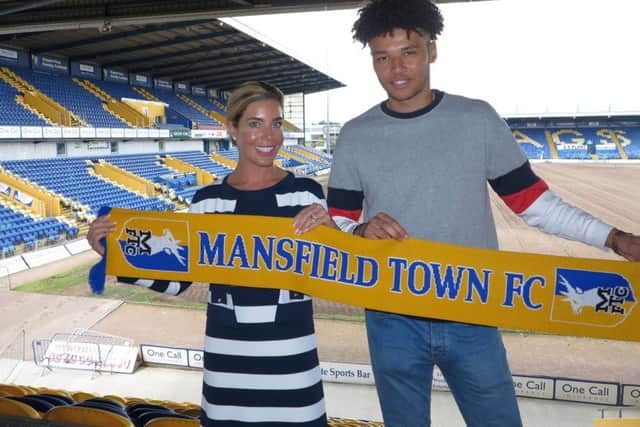 Stags CEO Carolyn Radford welcomes Lee Angol to the club .
