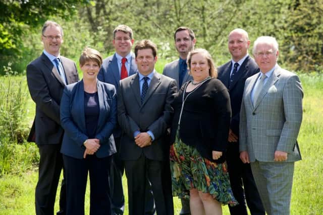 The senior management team at Robert Woodhead Ltd, led by managing director David Woodhead (far left). Also pictured, from left, are Teresa Westwood, Glenn Slater, Steve Gribby, Tom Woodhead, Hilary Cheshire, Craig Pygall and Derek McGrath.