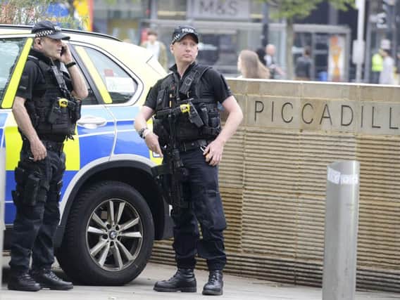 Armed police on the streets of Manchester after Monday night's attack. Photo - SWNS