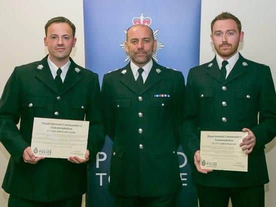 PCs James McQuaid and Simon Williams with Chief Superintendent Mark Holland.