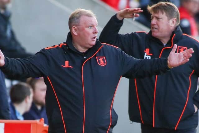 Mansfield Town's Manager Steve Evans with his assistant Paul Raynor - Photo by Chris Holloway