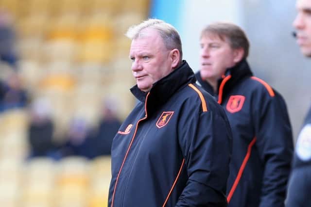 Mansfield Town Manager Steve Evans with assistant Paul Raynor behindPicture by Dan Westwell