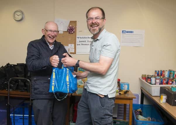 Hucknall Food Bank, Alan Porter from Kings Family Church drops off some donated food to administrator Ed Rippon