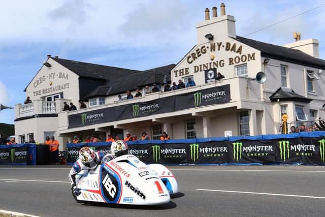 The Birchall brothers, Ben and Tom, on their way to victory in the first sidecar race of the 2017 Isle Of Man TT event. (PHOTO BY: Wally Walters)