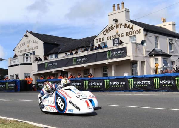 The Birchall brothers, Ben and Tom, on their way to victory in the first sidecar race of the 2017 Isle Of Man TT event. (PHOTO BY: Wally Walters)