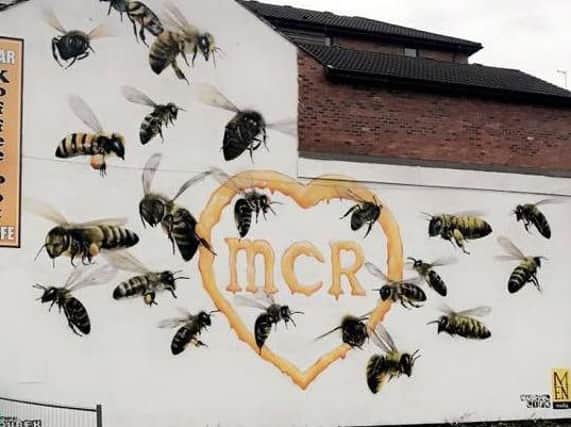 The mural painted by graffiti artist Russell Meeham , also know as Qubek which pays tribute to the Manchester bombing victims