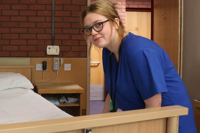 Vision Studio School student Erin O'Shea at work in Portland College's student accommodation.