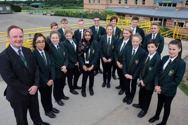 Head teacher, Carl Atkin with students from the Brunts School who are celebrating a 'Good' Ofsted report.