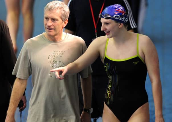 Rebecca Adlington poolside with her then coach Bill Furniss.