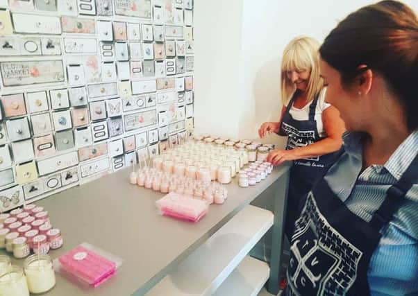 Mum Chantelle North putting the finishing touches to the fragrant candles.