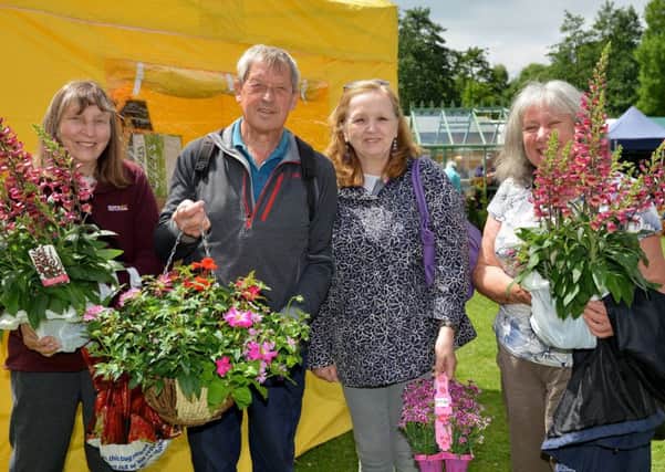 East Midlands Flower Show at Newstead Abbey, keen gardeners with their purchases from left Linda and Dave Epton, Diane Allsopp and Sheila Cupit