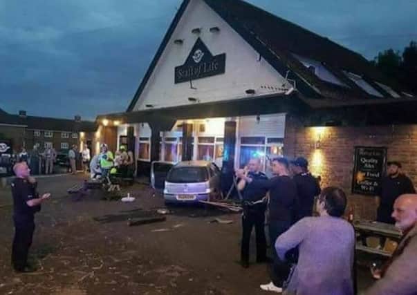 A car smashed intot he Staff of Life pub at Sutton on Sunday July 2.