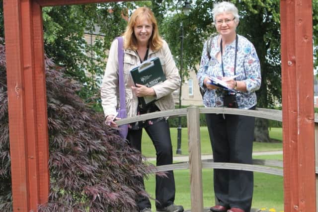 East Midlands In Bloom judges Sharon Sutton and Diane Moore cast their eye over one of Mansfield's floral creations.