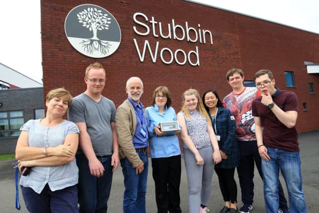 Students and staff at Stubbin Wood School with one of the time capsules at the summer fair.