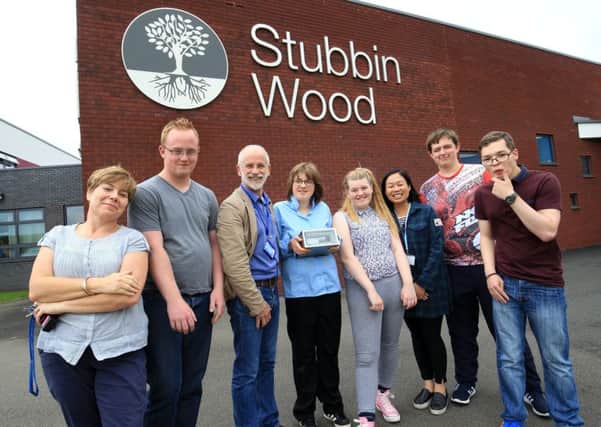 Students and staff at Stubbin Wood School with one of the time capsules at the summer fair.