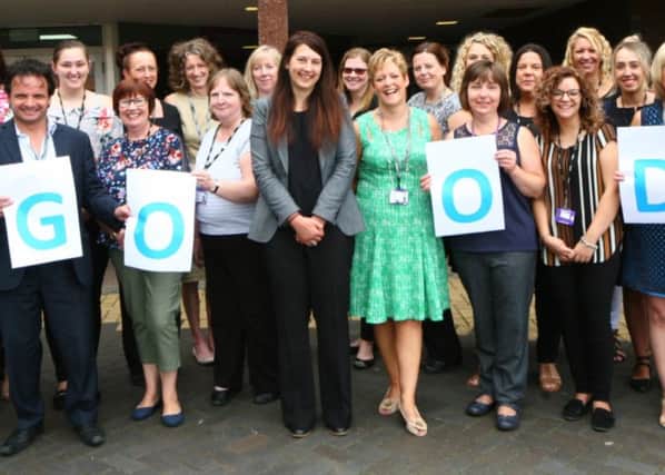 Principal Liz Barrett (centre), tutors, apprentices, students and staff at the trust celebrate their Ofsted rating.