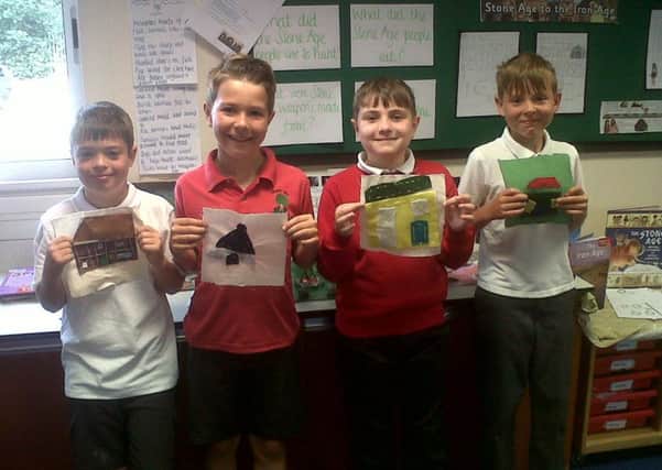 Pupils with their artwork, prior to it being sent off for the exhibition