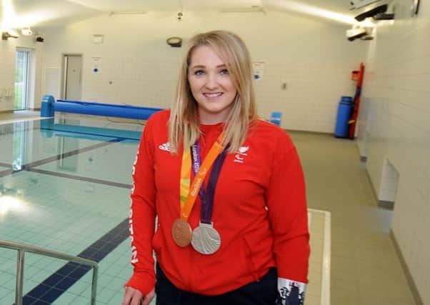 Charlotte Henshaw pictured with her Paralympic silver and bronze medals from London 2012 and Rio 2016 before making the switch to canoeing