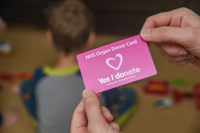 "Yes I donate" NHS organ donor card. Card in hand.