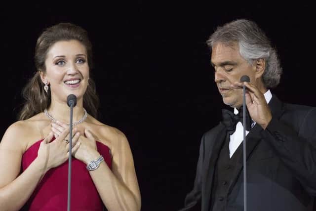 Carly Paoli on stage with Andrea Bocelli.