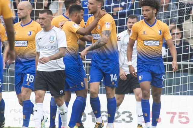 George Taft is congratulated by teammates after scoring Stags' opening goal. (PHOTO BY: Dean Atkins)