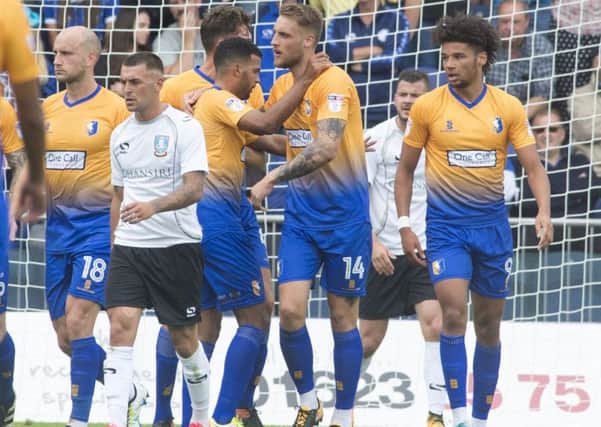 George Taft is congratulated by teammates after scoring Stags' opening goal. (PHOTO BY: Dean Atkins)