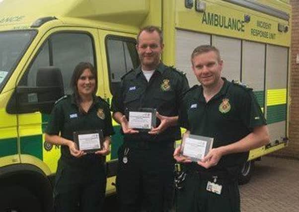 Three of the medics, (from left) Anna Challis, Jim Adler and Jason Buckle, with their awards.