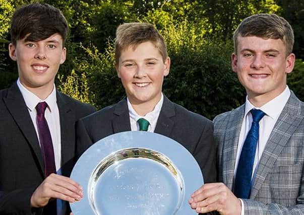 The victorious Ashfield School golfers, from left, Sam Greatorex, Finn Nelson and Callum Thorpe, with the English Schools Team Championship trophy. (PHOTO BY: Adrian Judd, Leaderboard Photography)